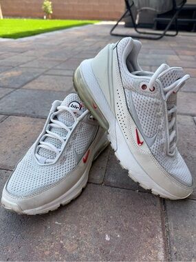 Nike Women’s White and Light Gray Air Max Sneakers with Red Swoosh
